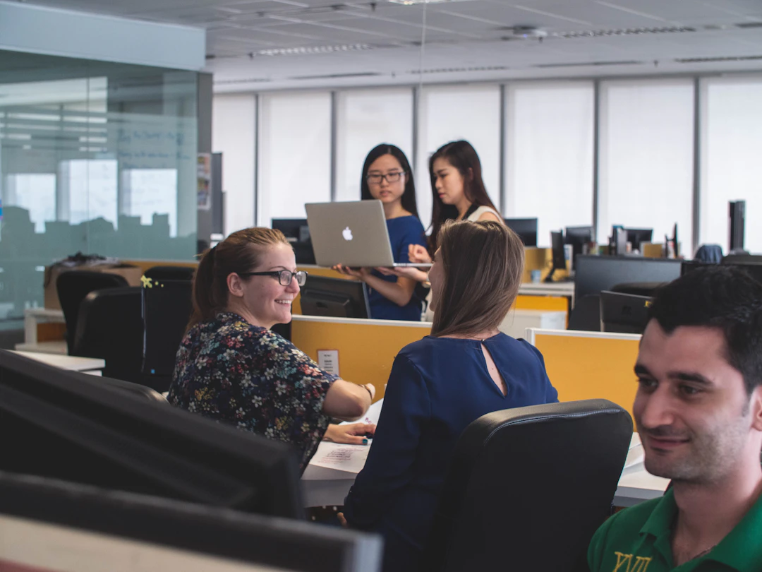 Operations team collaborating in an open office
